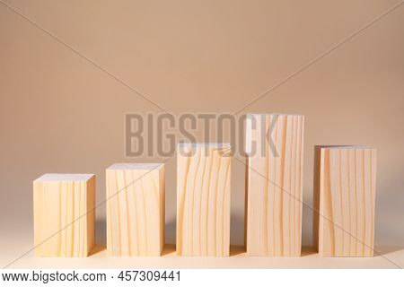 Podiums With Wooden Patterned Bars On A Beige Background. Stands For Any Product. Difference In Heig
