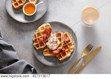 Trendy Breakfast With Croffles And Morning Coffee, Strawberries. Croissant As Waffle.
