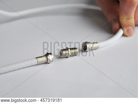 Coaxial Cables Connection, Tv Cable Connector.repairman Connecting Two Coaxial Tv Cables.