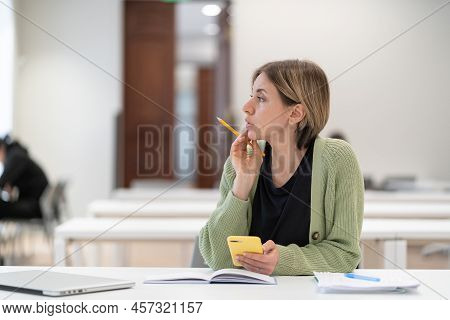 Mature Female University Student Taking Second Degree Distracted From Study, Dreamy Pensive Middle-a