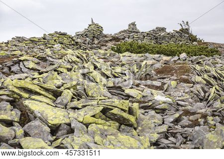 Stone Hill For Tourist Sign Covered With Yellow Moss, Syvulya Mountain In Carpathians, Ukraine