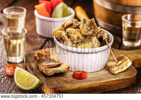 Crispy Fried Pork Rinds Or Bacon, Served With Cachaça Or Pinga, Typical Food From Minas Gerais