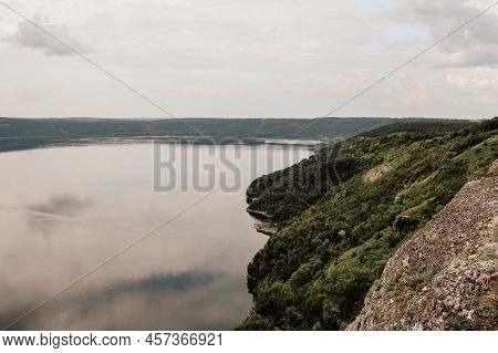 Panoramic Landscape Of Bakota Bay. High Rocky Banks Of A Large River With Calm Smooth Water. Dnieste