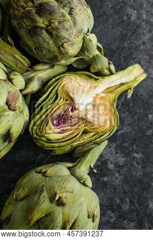 Fresh Artichoke On Black Background. Raw Artichok Closeup