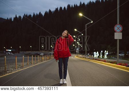 Full Length Photo Of Relaxed Female Traveler With Closed Eyes Touching Hear On Mountain Forest Backg