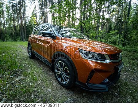 Minsk, Belarus - June 2022: Orange Geely Coolray Car.