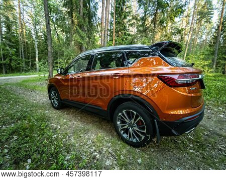 Minsk, Belarus - June 2022: Orange Geely Coolray Car.