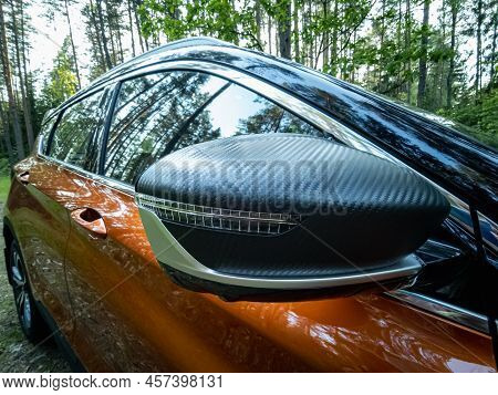 Minsk, Belarus - June 2022: Orange Geely Coolray Car.