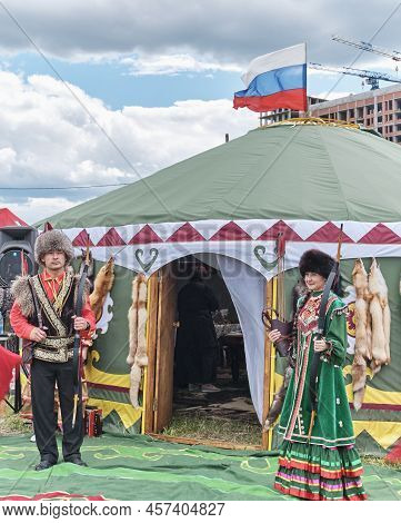 Yekaterinburg, Russia - June 25, 2022: Asian Woman And Man In Traditional Festive Bashkir Clothes, F