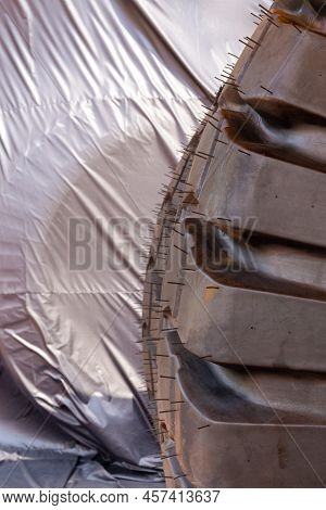 Huge Rear Wheels Of Dump Truck At Unusual Angle Closeup.