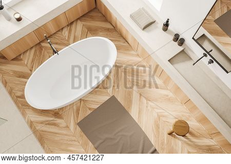 Top View Of White Bathroom Interior With Bathtub On Hardwood Floor. Washing Corner With Sink And Mir