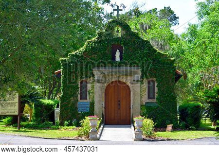Historic Church Chapel With Green Ivy Growing Along The Exterior Of The Building. Located At St. Aug