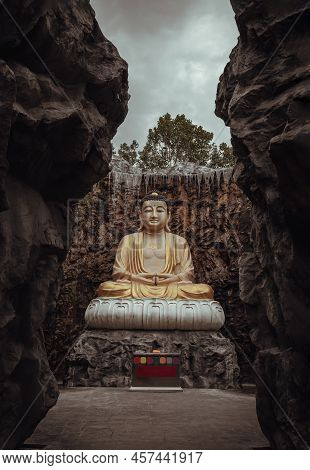 Samut Sakhon Thailand - May 21, 2022: Big Golden Buddha Statue In The Middle Of A Beautiful Cavein, 