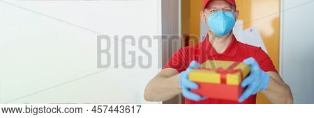 Portrait Of Courier Man Wearing Face Mask, Safe Delivery During Pandemic Times. Worker In Uniform De