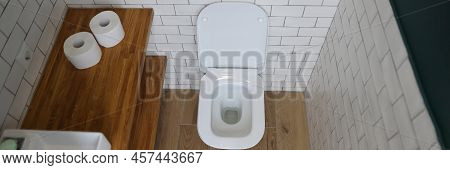 Top View Of Modern Bathroom Interior With Wooden Shelves, White Sink And Toilet. Fresh Interior In D