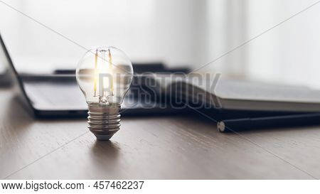 Bright Light Or Glowing Lamp With Book Or Textbook. Business Success Idea And Education, Studying An