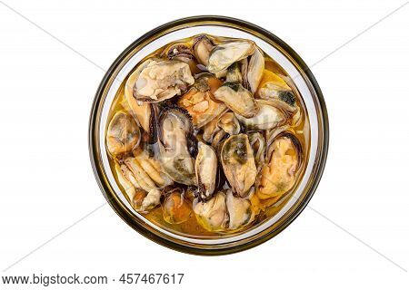 Marinated Mussels Isolated In A Jar On A White Background. Full Depth Of Field. File Contains Clippi