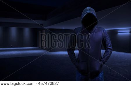 Home Burglar In A Robber Breaking Into The House. Empty Space For Text Or Draw