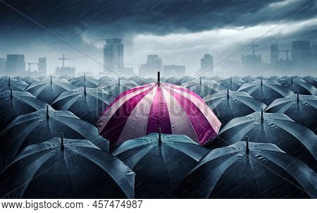 Pink And White Umbrella With Dark Stormy Clouds. Concept For Success.