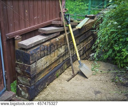 A Stack Of Sleppers And Hand Tools For Excavation Works, Outdoor Shot