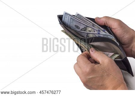 Close Up View Of Wallet With Dollar Banknotes In Man's Hands.