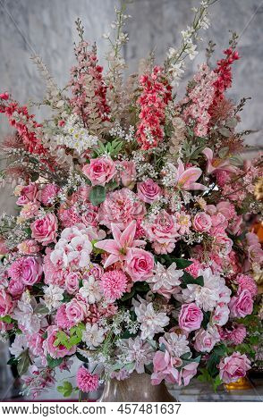 Big Bouquet Of Flowers In A Vase On A Gray Wall Background