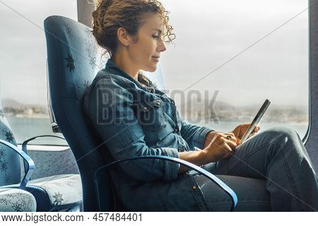 Woman Enjoy Travel Leisure Using Mobile Phone On Board Seats And Having Relax. Cruise Ship Boat Seat