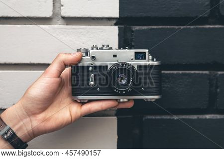Close-up, Vintage Film Retro Camera In Male Hands.