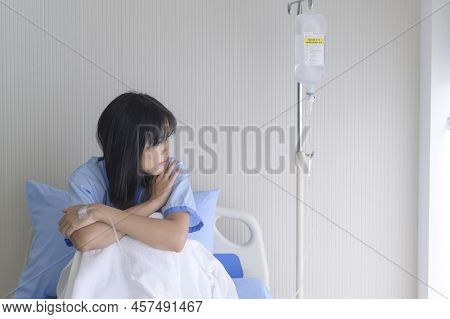 A Despondent Asian Woman Patient. Following The Doctor's Declaration That The Cancer Was Nearing The