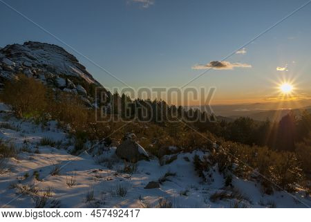 Mountain La Muela La Garganta Extremadura With Snow At Sunset With Sun