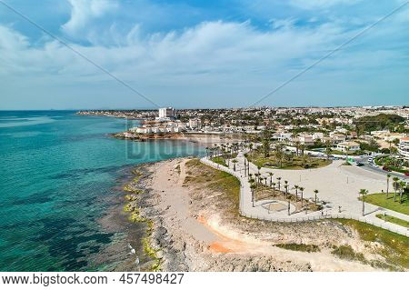 Playa Flamenca Seafront Along Turquoise Mediterranean Sea During Sunny Summer Day, Province Of Alica