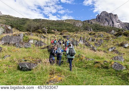 Azuay, Ecuador - May 29, 2022: Tourist On Hiking Trail To Mountain San Pablo Next To Lagoon Busa In 