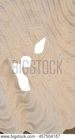 Light Brown Abstraction From Different Spots. On A Light Brown Background, There Are Several Bright 