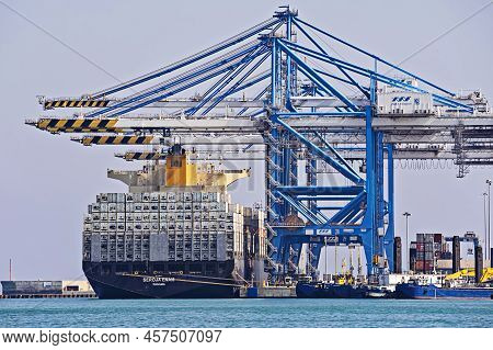 Port Activities, Big Container Ship Discharging And Loading In Freeport Terminal. Container Ship Unl