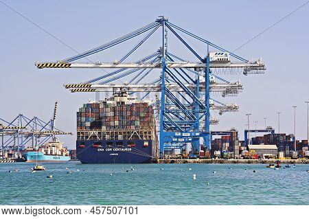 Port Activities, Big Container Ship Discharging And Loading In Freeport Terminal. Container Ship Unl
