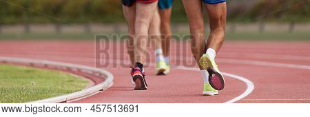 Athletes On Track In Race Walk Competition, Race Walking On Athletic Track