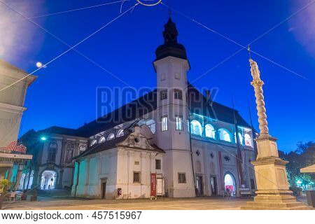 Maribor, Slovenia - June 2, 2022: Night View On Maribor Castle And Saint Florian Column. Maribor Cas