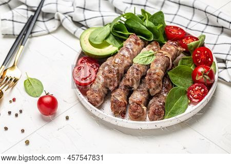 Chevapchichi Or Kofta Kebab, Bacon Wrapped Minced Meat With Spinach, Avocado And Cherry Tomato, Heal