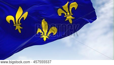 The Flag Of Ile De France Region Waving In The Wind On A Clear Day. Ile De France Is The Most Populo