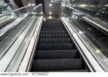 Modern Escalator Electronic System Inside A Building. Escalator In Community Mall, Shopping Center. 