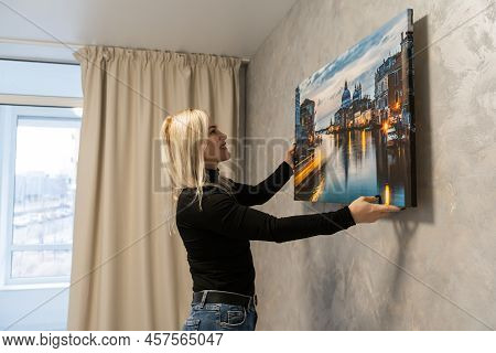 Photo Canvas Print. A Woman Holding A Photography With Gallery Wrap. Photo Printed On Glossy Synthet