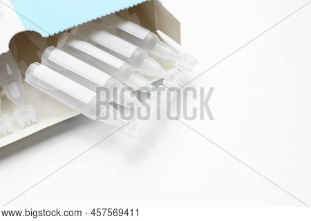 Package With Single Dose Ampoules Of Sterile Isotonic Sea Water Solution On White Background, Closeu
