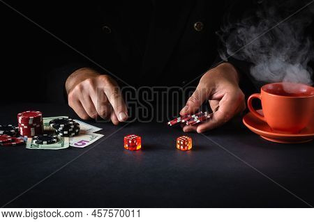 A Player Places A Bet With Chips On A Winning Combination When Playing Craps In A Poker Club. Luck O