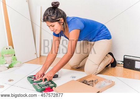 Independent And Success Bolivian Latin Woman Assembly And Fix Repair In Moving House