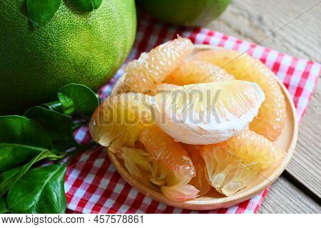 Fresh Green Pomelo Peeled And Leaf Frome Pomelo Tree , Pummelo , Grapefruit In Summer Tropical Fruit