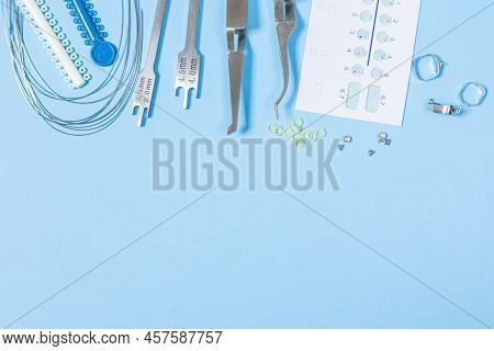 A Set Of Special Tools For An Orthodontist To Install Braces For A Patient. Orthodontic Arcs, Ligatu