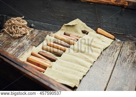 Medieval Tools For The Construction Of Sailboats And Ship Building. Reconstruction Of The Events Of 