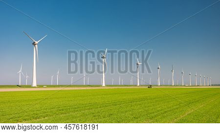 Windmill Park In The Ocean, Drone Aerial View Of Windmill Turbines Generating Green Energy Electric,