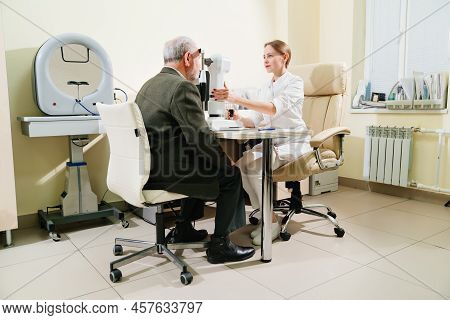 Ophthalmologist Examination Of Elderly Man On Corneo Topographer.modern Clinic