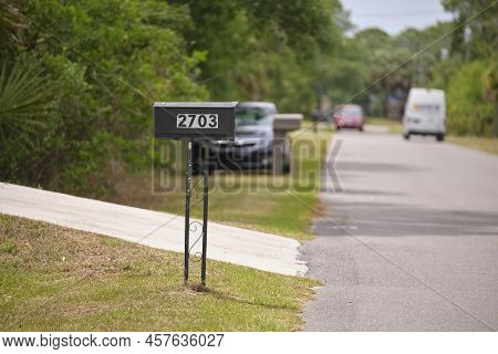 Typical American Outdoors Mail Box On Suburban Street Side